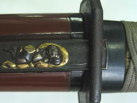 Tanto Koshirae: Brown Lacquered Mounting with Mitsudomoe Crest — 8 of 15
