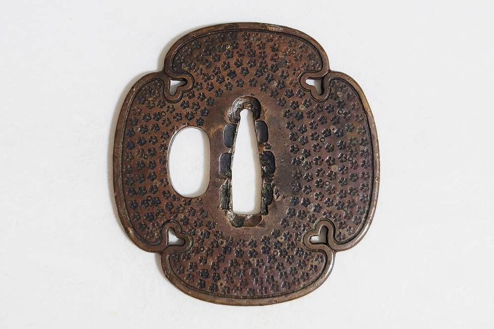Tsuba: Small Flower Pattern, Mumei (Shonai) — 1 of 11